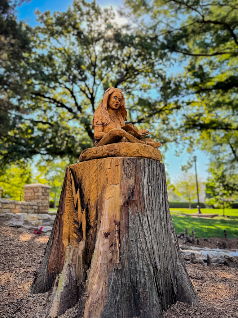 Theta Pond Tree Sculpture of a young girl reading